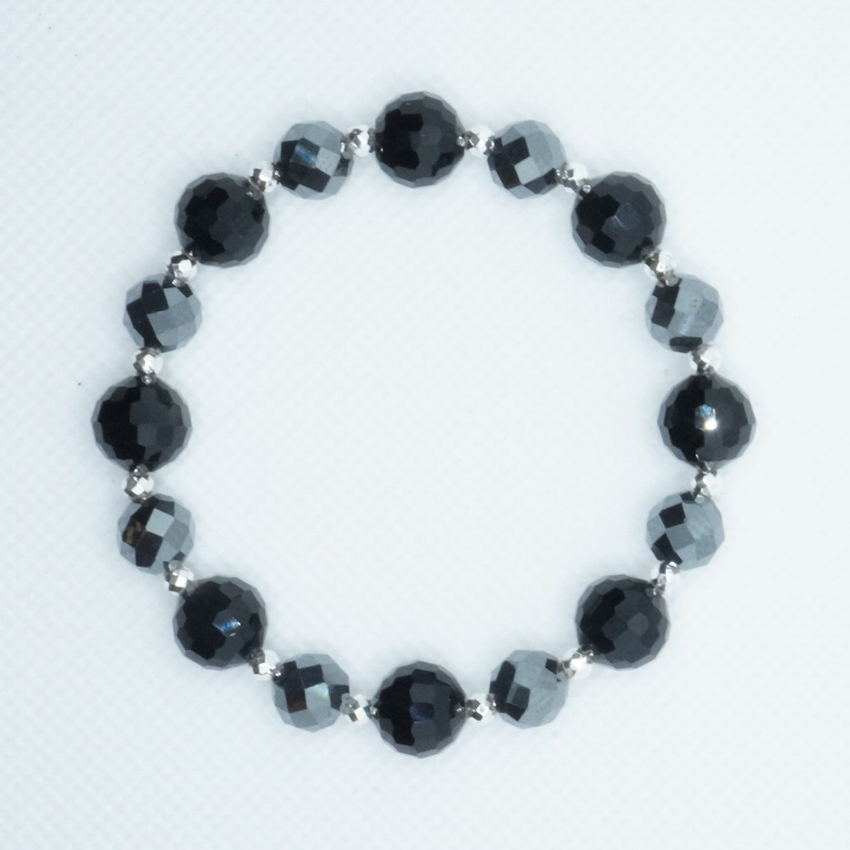 Bransoletka kryształu czarnego i hematytu szarego i srebrnego. Największa kula fasetowana 10 mm