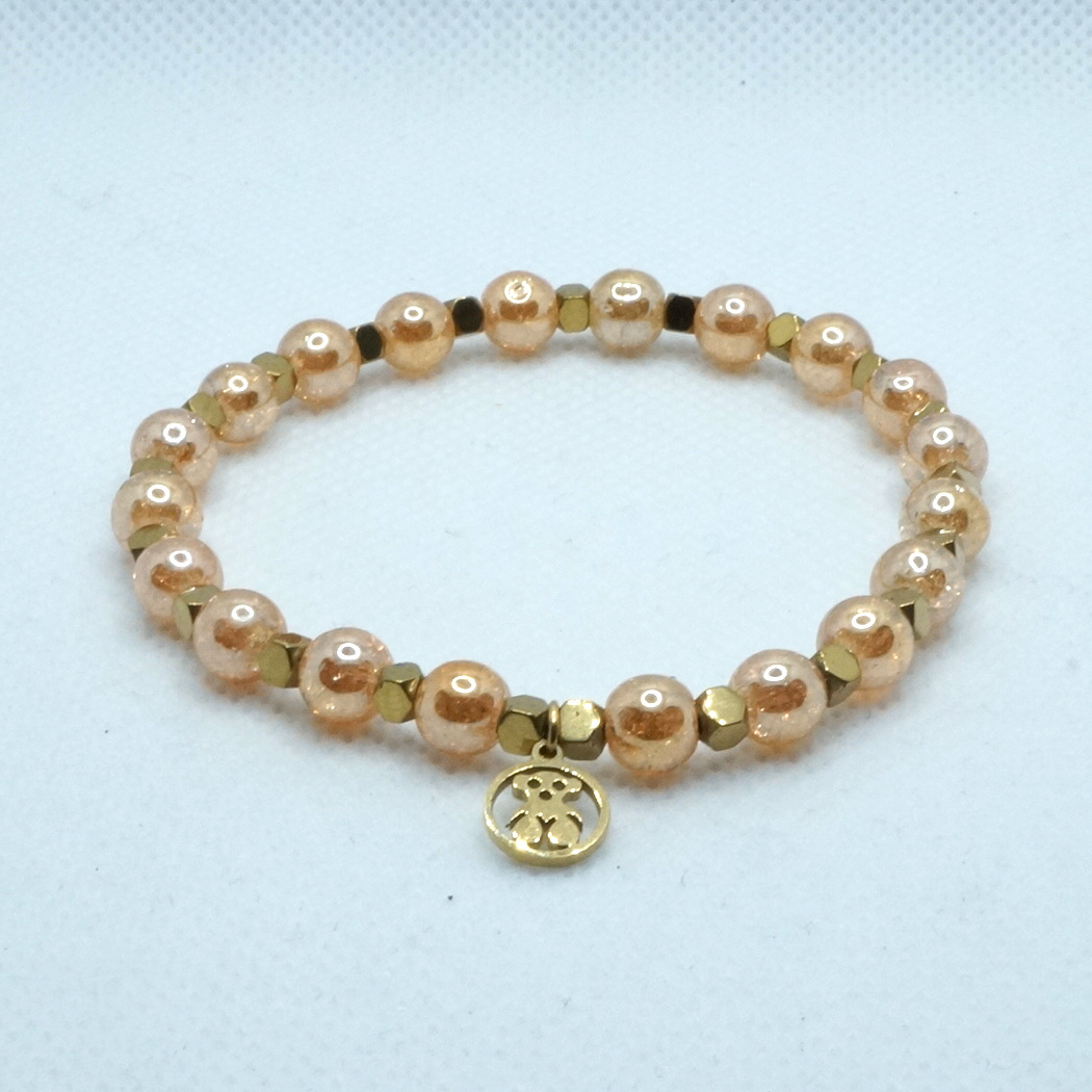 Bransoletka z kryształem górskim i złotym hematytem.